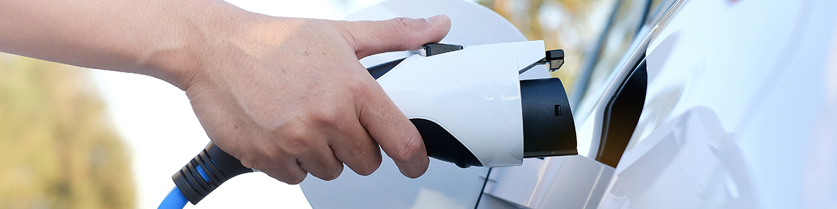Electric car at charging station