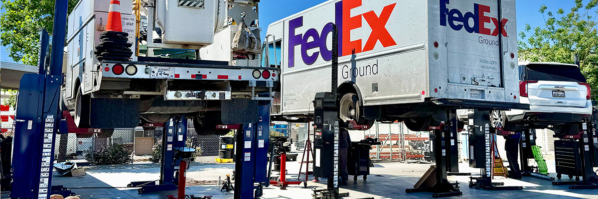 Trucks lifted up on lift