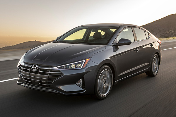 Front 3/4 shot of 2019 Hyundai Elantra driving down road