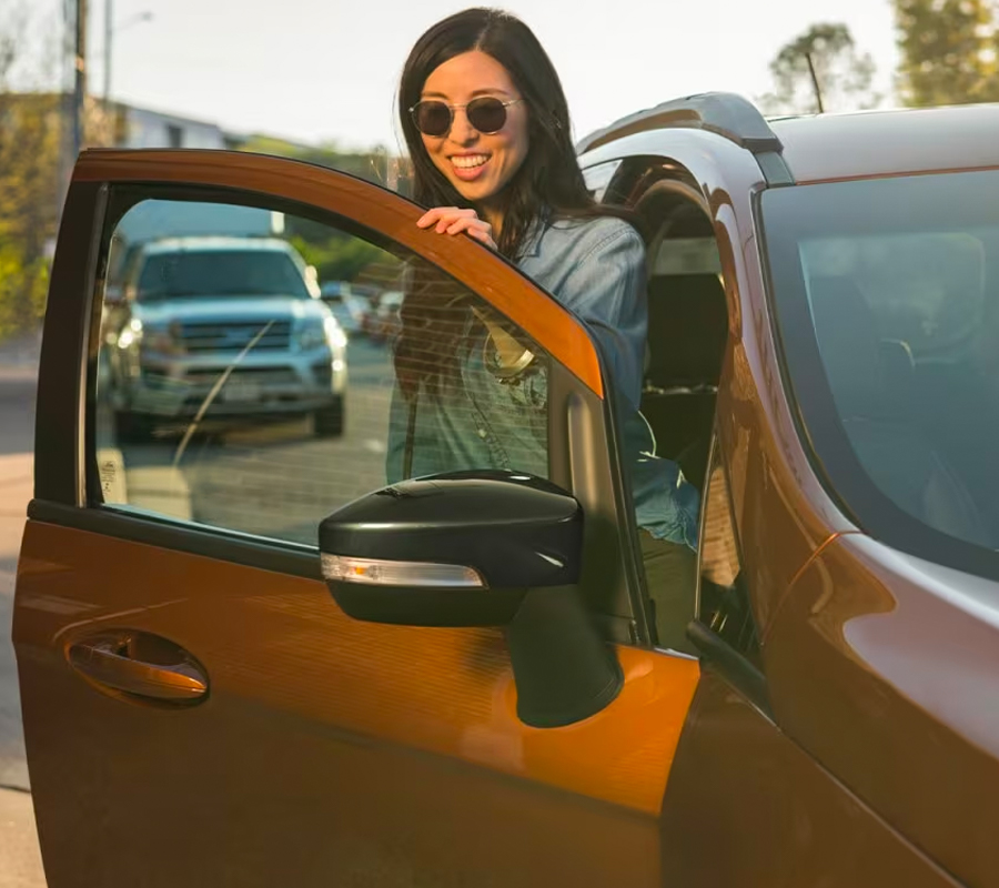 Female passenger exiting parked 2020 Ford EcoSport in Canyon Ridge