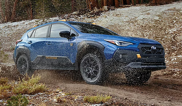 Subaru Crosstrek driving through mud