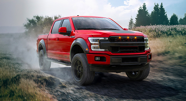 Ford ROUSH racing along the dirt highway