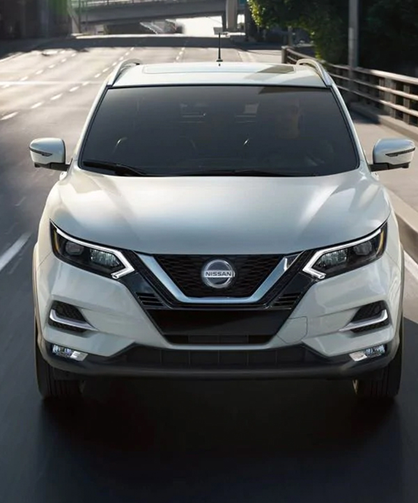 Woman walking away from Nissan Rogue