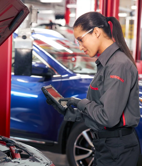 technician inspecting car