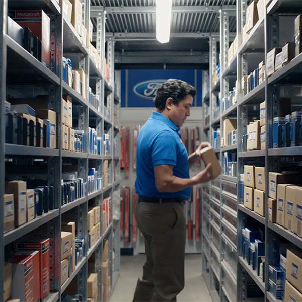Service tech checking inventory for parts