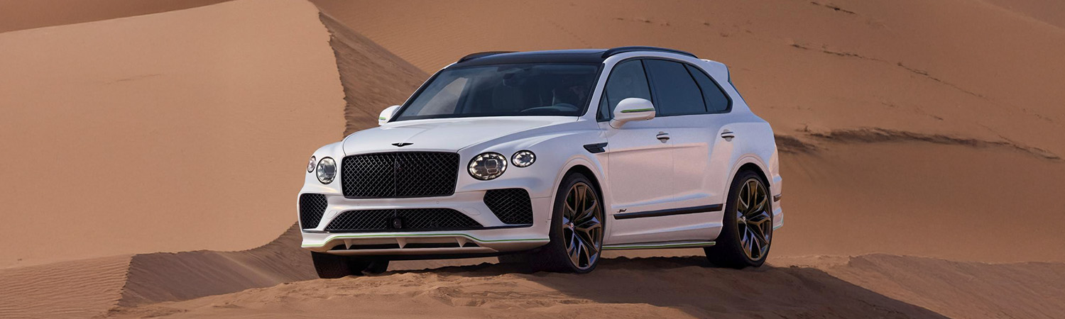 Shot of Bentley Bentayga parked on sand dune