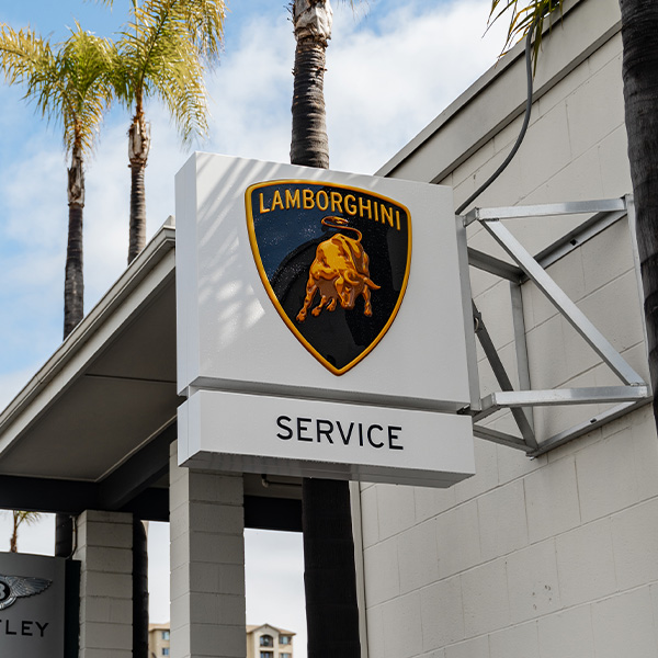 Shot of Lamborghini Service sign outside of dealership