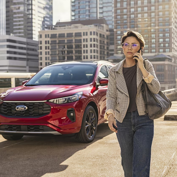2024 Ford Escape parked in city with woman on phone