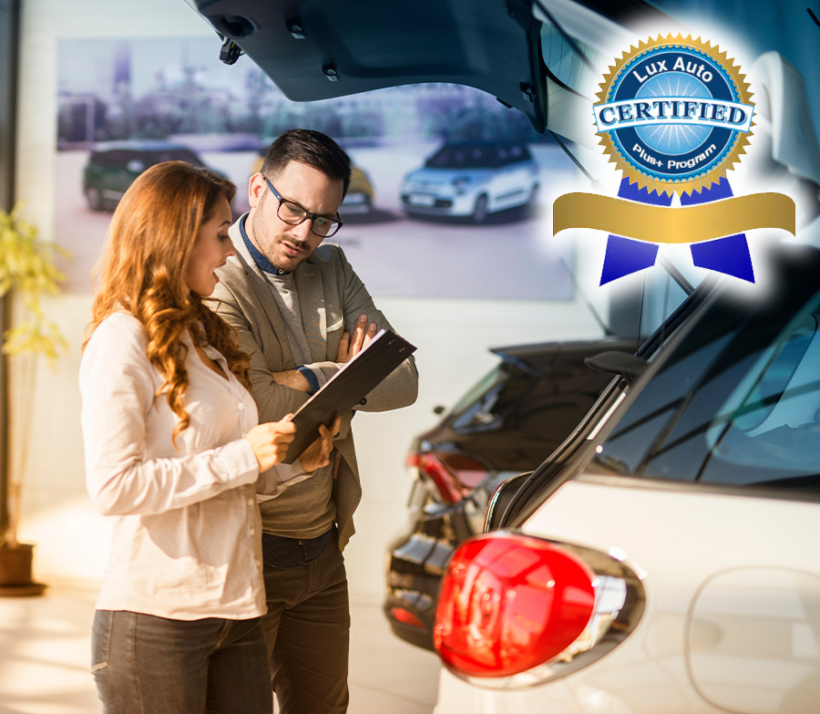 Car dealer presenting new car to the customer. Vehicle dealership.