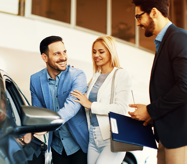 Happy customers in dealership