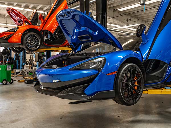 McLaren on the lift in the service bay