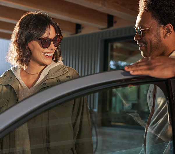 Two people talking and about to get inside a Hyundai vehicle