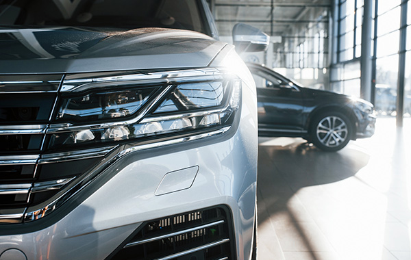 Up close front shot of car in dealership showroom