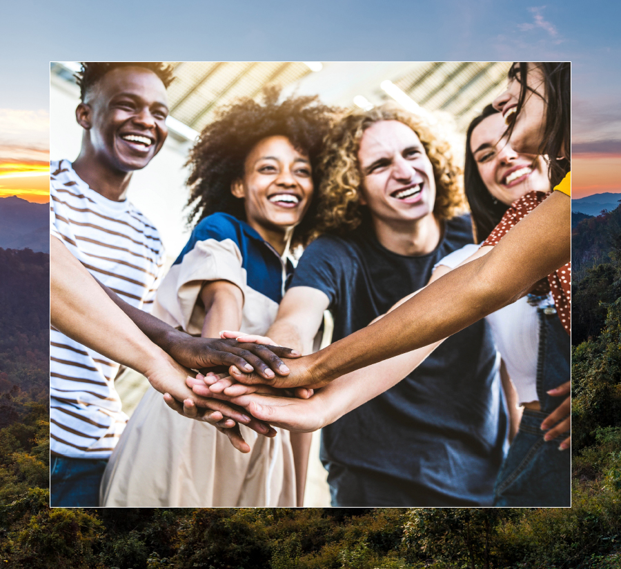 group of people touching hands