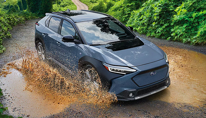 Subaru Solterra driving through mud