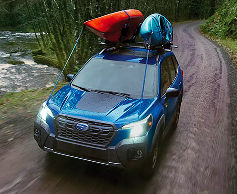 Subaru Forester driving through mud