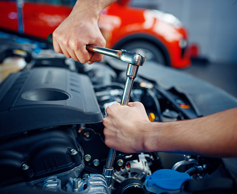 Technician working on an engine
