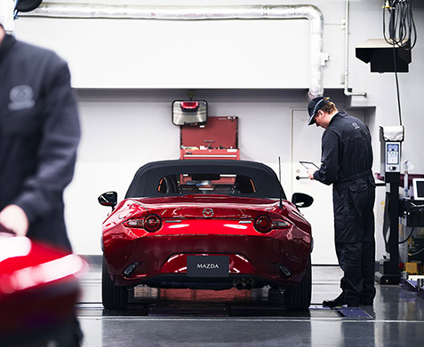 Technician working a MAZDA Miata