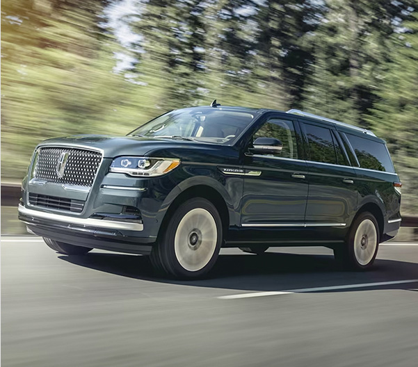 Head on shot of Lincoln driving down road