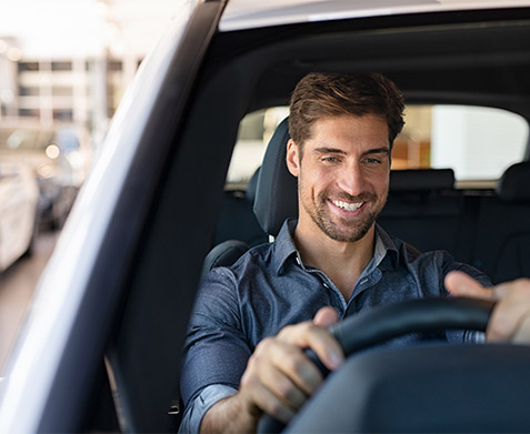 Man behind the wheel of a car
