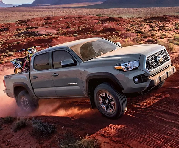 2020 Tacoma driving offroad on a rocky terrain