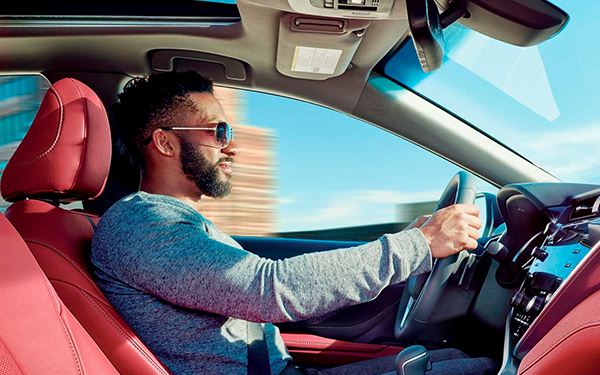 Man Driving A 2020 Toyota Camry
