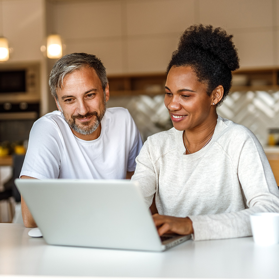 Couple looking at laptop together