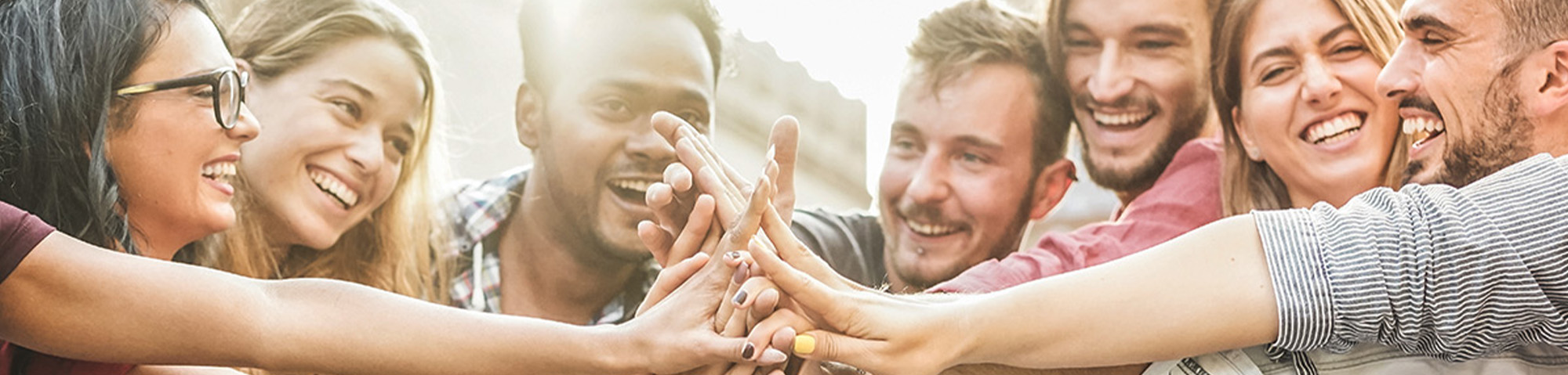 Group of people putting their hands together