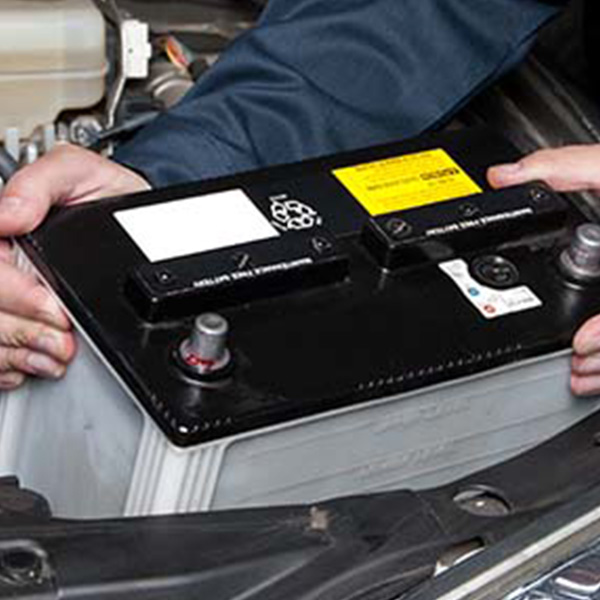 Ford Service worker working on a vehicle.