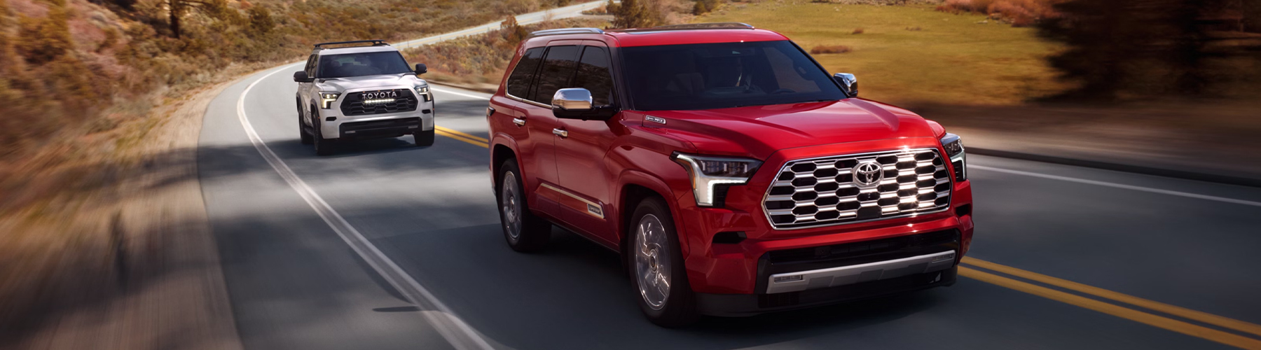Toyota Sequoia Capstone shown in Supersonic Red. TRD Pro shown in Ice Cap.