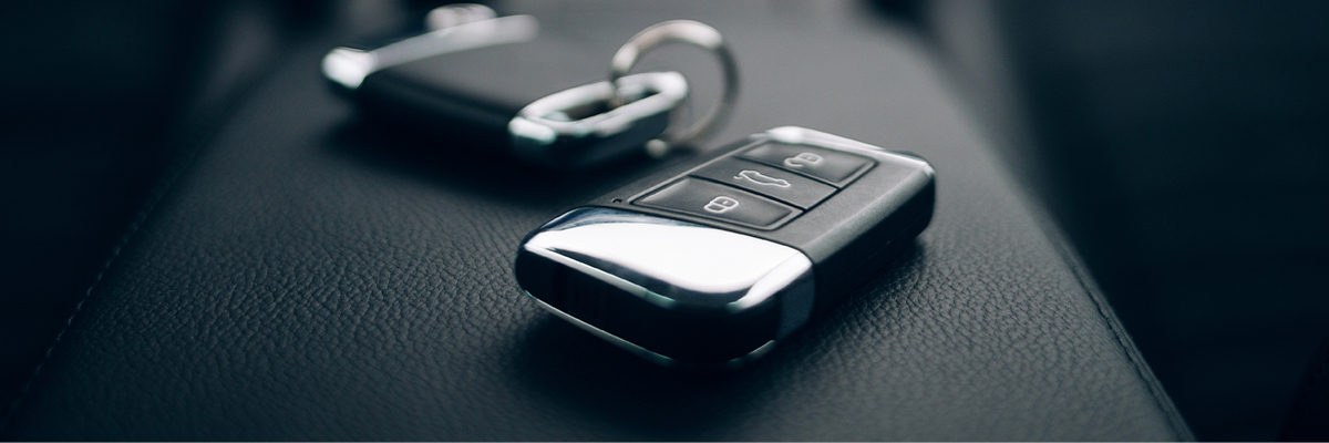 Close shot of car keys sitting on center console of car