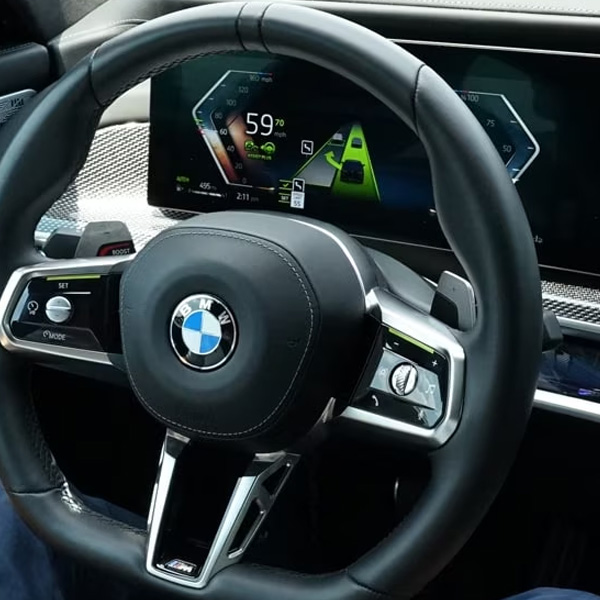 Up close detail shot of BMW dashboard and steering wheel