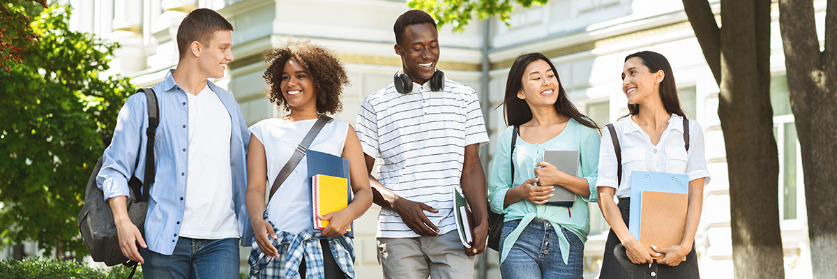 College Student friends walking through campus