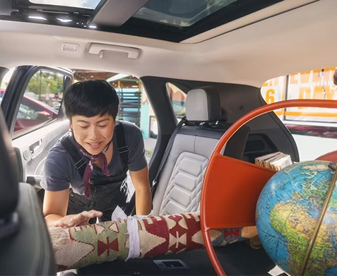 Ford Escape backseat being loaded with things