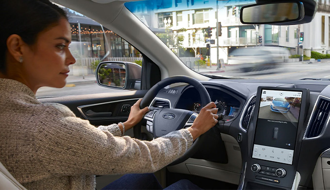 Woman driving in Ford Edge