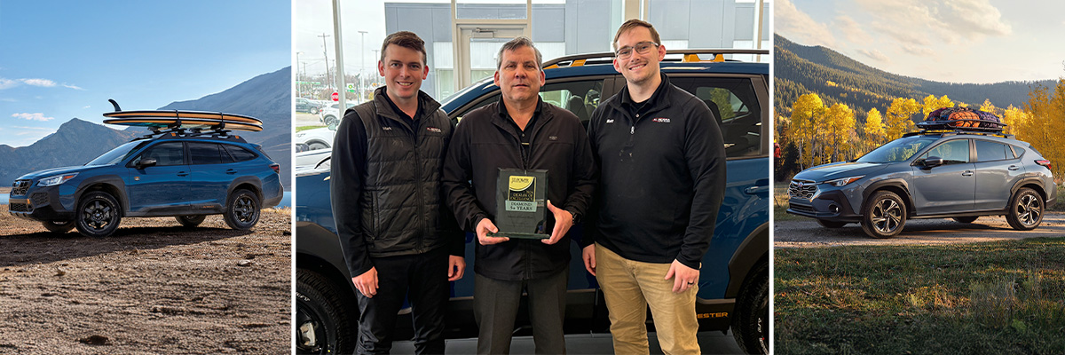 Subaru lineup with employees holding up Subaru Love Promise Award 2025