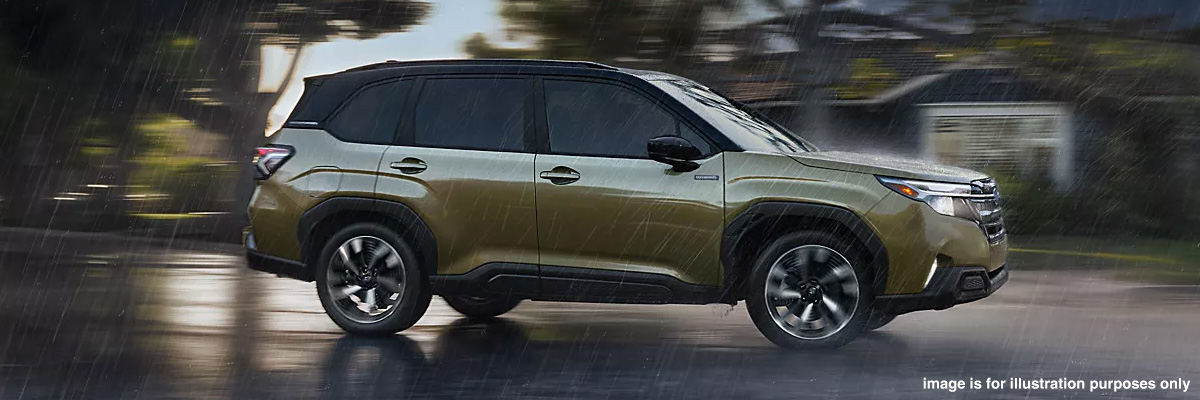 Subaru Forester Hybrid driving on a road during a rainy day. Image for illustration purposes only.